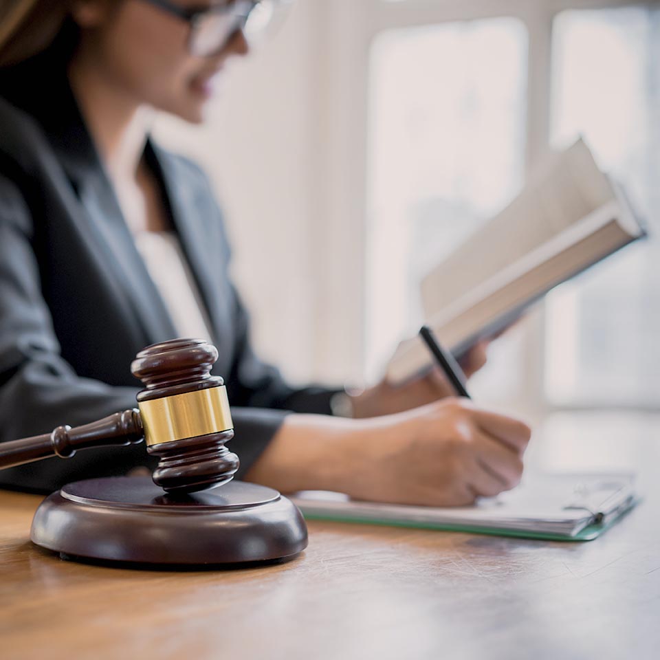 Lawyer business women consultant reading and writing on a note in office. Law, legal services, advice, consult, Justice concept.